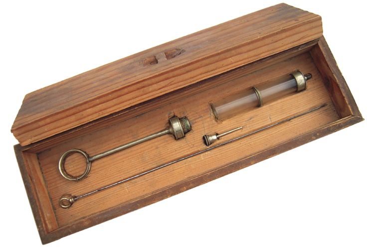Misterious_antique_Syringe_1 Interesting and unusual finely decorated glass and silver () hypodermic syringe . Complete set stored in its original wooden box with hand-carved housing. A proper thanks for thei